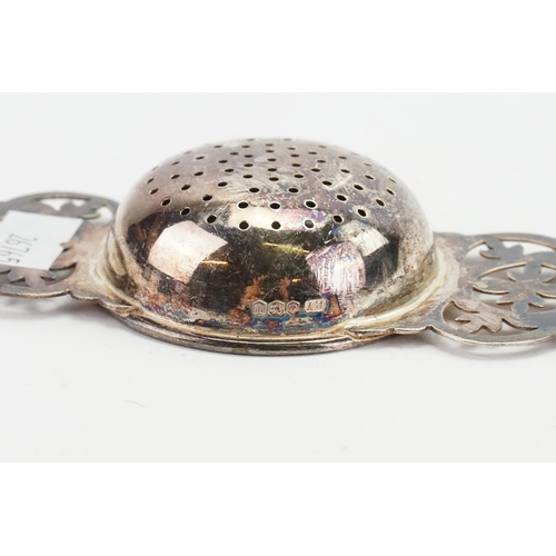 23 - A 1962 Viners silver tea strainer. Weight 33.1g.