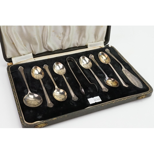 26 - A silver Lanson Ltd cased spoon and tong set. Weight 101.5g.