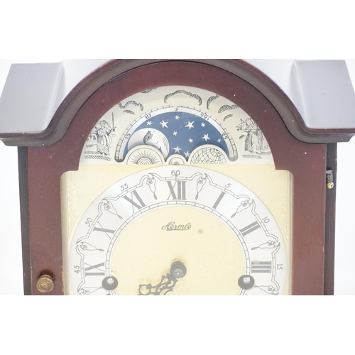 401 - A German made Bracket Clock with nickel silver dial, Brass Moon Face, Chine & Strike & resting on Br... 