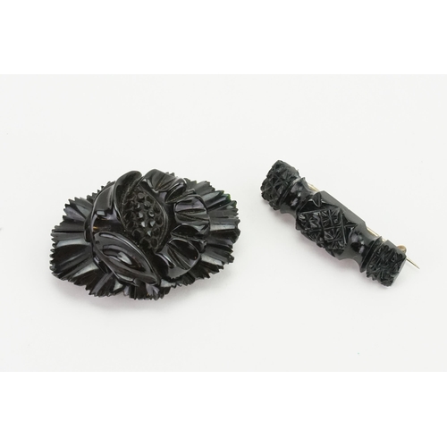 200 - A pair of carved Jet brooches. Possibly Whitby. Weight 20g.