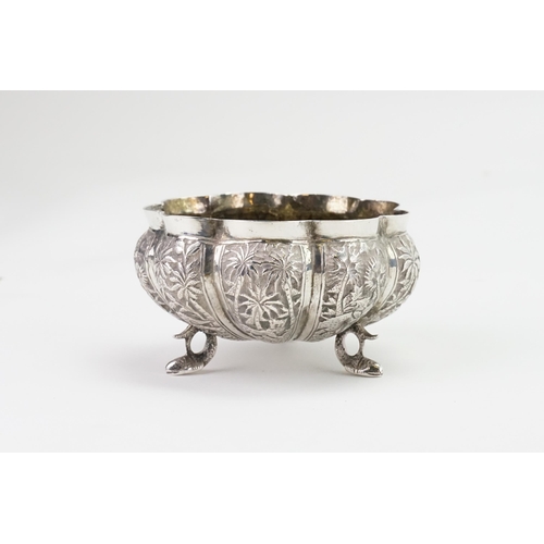 61 - A Indian silver bon bon dish, decorated with various animals. Weight 123g.