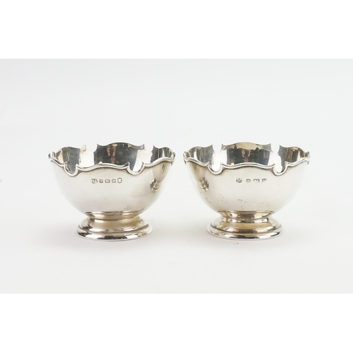 64 - A pair of 1930's decorative trophy cups, by Barker Brothers. Weight 144g.