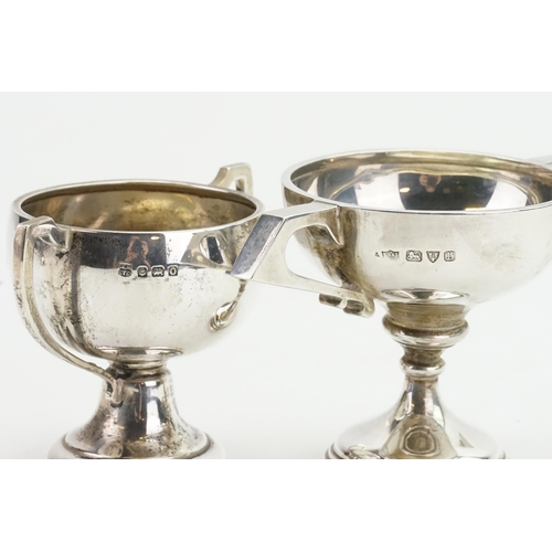 66 - Two silver trophy cups. Weight 189g.