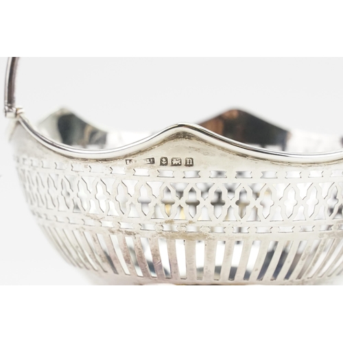 67 - A pair silver swing handled baskets. Weight 221g.