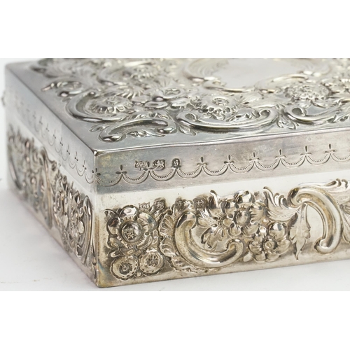 75 - A silver 1892 Samual Walton Smith embossed box. Weight 292g. 13cm x 10.2cm.