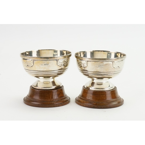 79 - A pair of silver Walker and Hall 1955 trophy cups. Weight 172g.