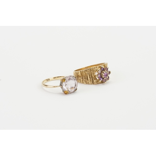 267 - Two 9ct gold rings, set with pink and purple stones. Weight 5.3g.