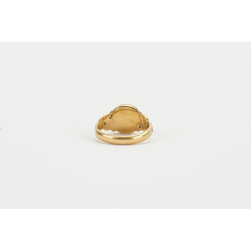 269 - A gold signet ring, tests around 14ct, set with a grey and red stone. Weight 4.5g. Size O.