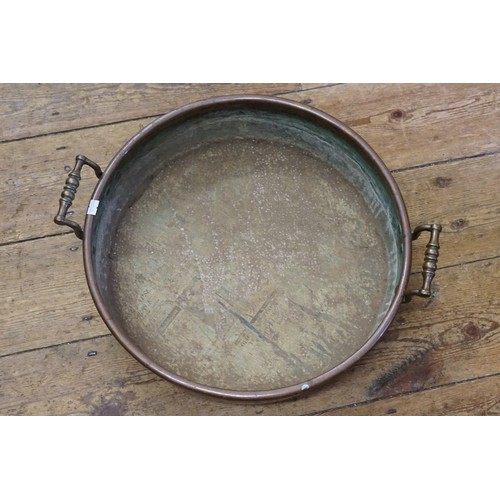 979 - A Regency Copper Two Handled Jam Pan. Measuring: 43cms across.