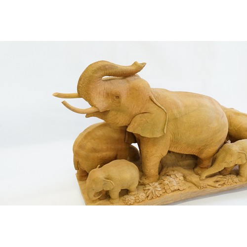 992 - A Large Carved Hardwood Study of a Female Elephant with her young. Measuring: 56cms long x 41cms hig... 