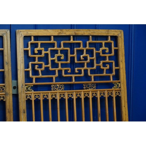 426 - A Pair of Chinese Hardwood & Pierced decorated Screens. Measuring: 60cms x 163cms.