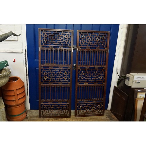 426 - A Pair of Chinese Hardwood & Pierced decorated Screens. Measuring: 60cms x 163cms.