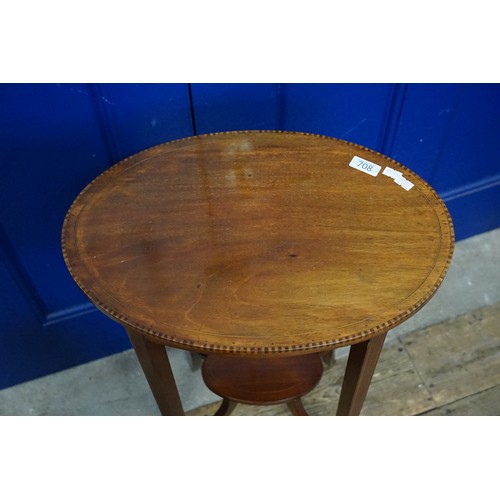 708 - An Oval Edwardian Mahogany & Satinwood inlaid Occasional Table resting on Splayed out Legs. Measurin... 