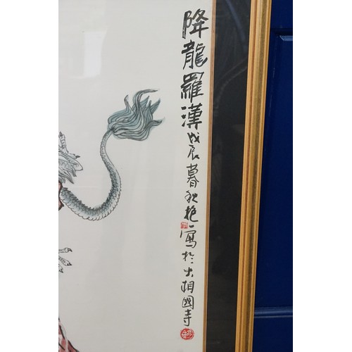 458 - A Japanese Water Colour of a God entwined  with a Dragon with a Red Seal mark. Measuring: 82cms x 10... 