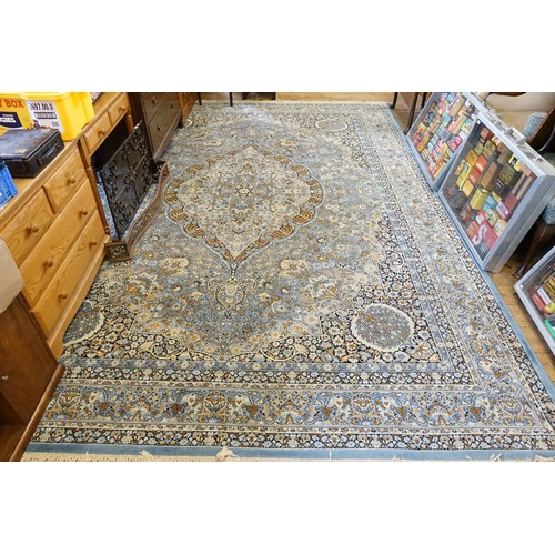 736 - A LARGE All Over Blue Ground Floral Bordered Axminster Carpet decorated with Chintz pattern & a Frin... 
