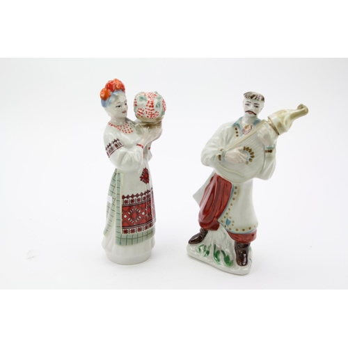 651 - A pair of Hungarian folk pottery liqueur decanters.