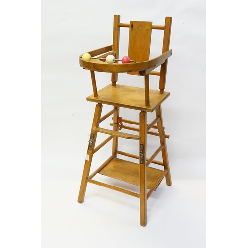 314 - A 1950s Dolls High Chair on a Fold Over Stand.