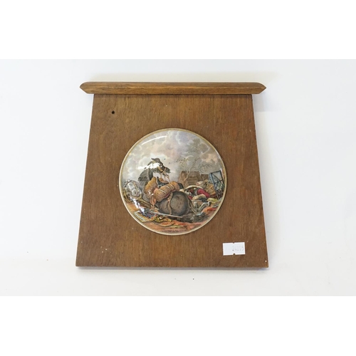 683 - A Pratt Ware Pot Lid depicting a War Horse & a fallen Soldier entitled War in Wooden Frame.