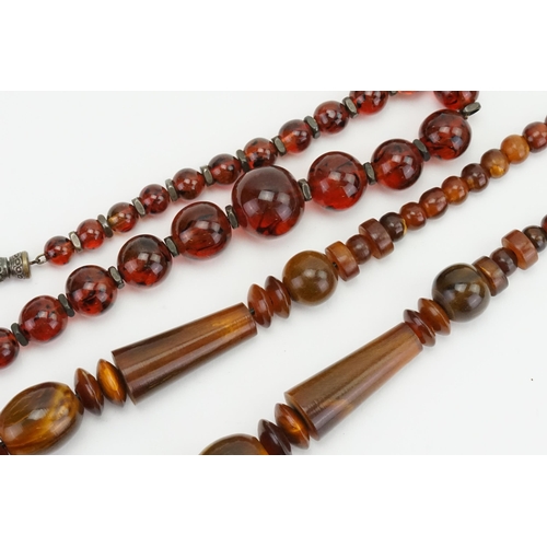 77 - An Amber Bead Necklace & one other.