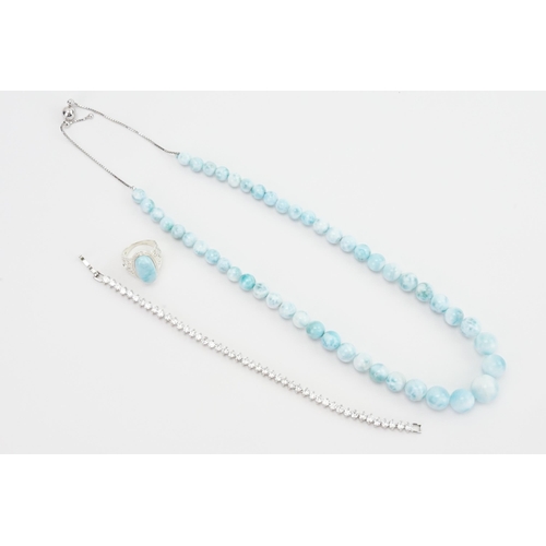 78 - A Blue Stone Silver Set Bead Necklace along with a similar Silver Ring and a Paste Tennis Bracelet.