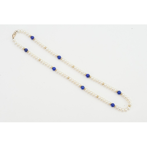 82 - A 9ct Gold Pearl and Lapis Set Necklace. Length: 47cms.