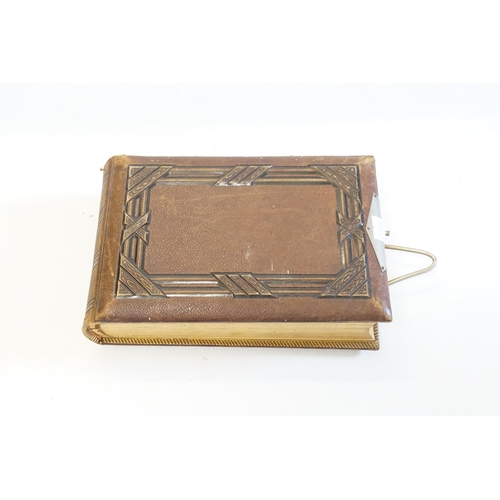 410 - A Photograph Album containing Victorian Photographs of the Clutton Family.