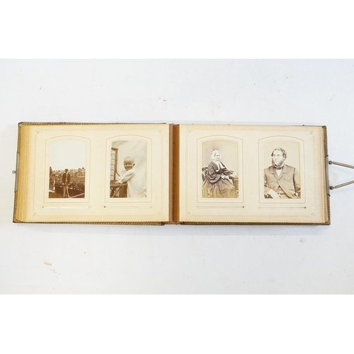 410 - A Photograph Album containing Victorian Photographs of the Clutton Family.