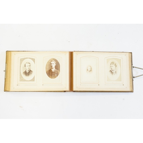 410 - A Photograph Album containing Victorian Photographs of the Clutton Family.