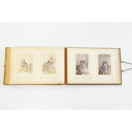 410 - A Photograph Album containing Victorian Photographs of the Clutton Family.