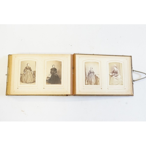 410 - A Photograph Album containing Victorian Photographs of the Clutton Family.