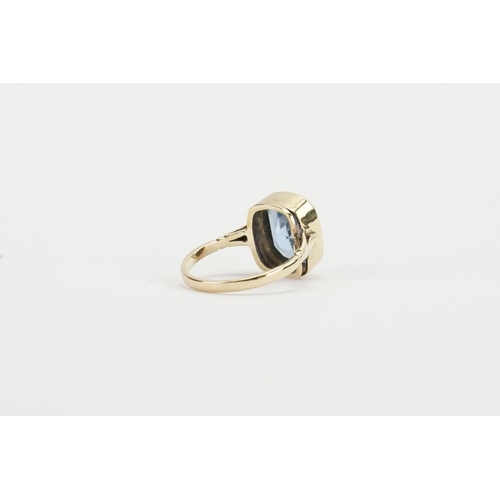 95 - A 9ct Gold Blue stone set Ring set with an emerald cut Gem approximately 11.5mm x 13.4mm, depth appr... 