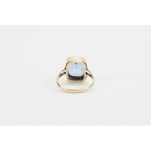 95 - A 9ct Gold Blue stone set Ring set with an emerald cut Gem approximately 11.5mm x 13.4mm, depth appr... 