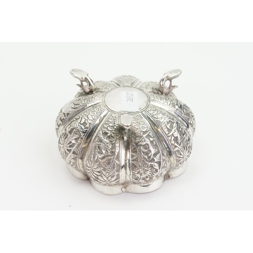21 - An Indian Silver bon bon Dish decorated with various animals. Weight: 123g.