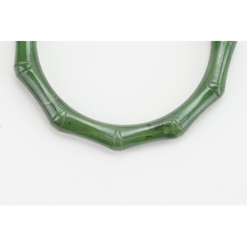 97 - An Apple Jade Colour Bangle in the Bamboo Style. Weight: 34 grams.