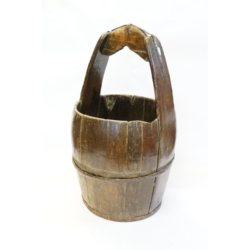 613 - An Eastern European Staved Grain Bucket with an Iron Handle.