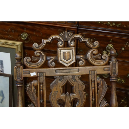 438 - A Victorian Walnut Framed Pierced & Carved Back Fold-Up Coaching Chair with a Cane Seat.