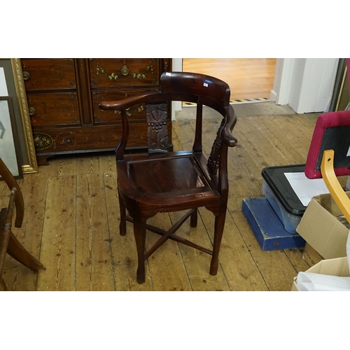 439 - A Chinese Carved Hardwood Corner Chair with Cross Stretcher & panelled seat.