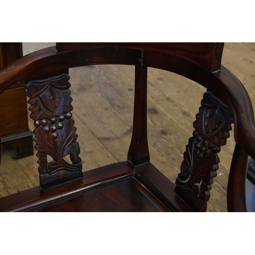 439 - A Chinese Carved Hardwood Corner Chair with Cross Stretcher & panelled seat.