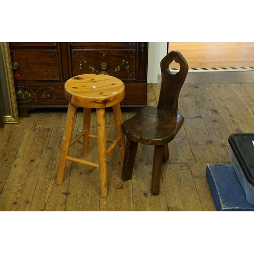 442 - A Heavy Oak Irish Milking Stool with piecred back & square legs along with a Clumpy Pine Stool.