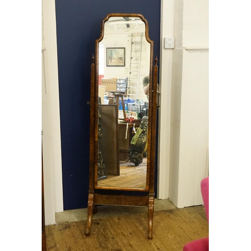 474 - A Walnut Framed Chevelle Mirror resting on a gadrooned & ballbase. Measuring: 49cms across x 161cms ... 