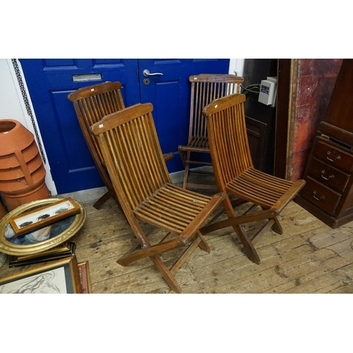 698 - A Set of Four Fold-Up Slat Backed Garden Chairs.