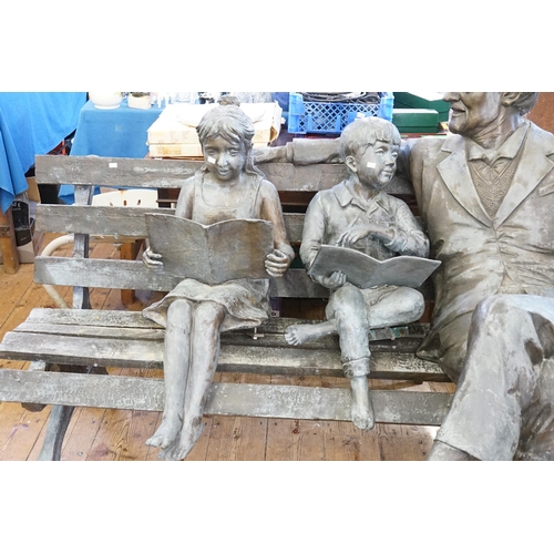 712 - A Life Size Study of an Elderly Gentleman in a Suit resting on a Bench with Two Children reading a b... 