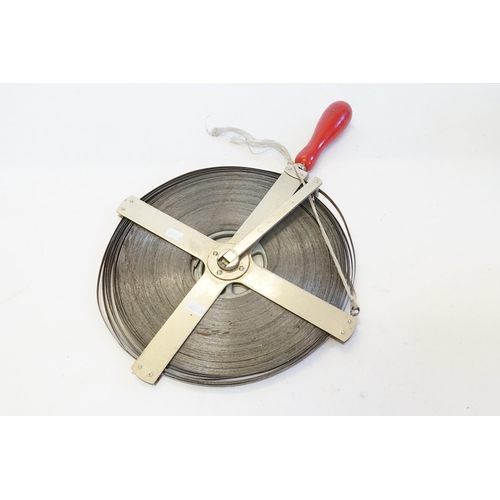 594 - A Surveyors 100 meter Steel Tape Measure contained in a Circular Extending Nickel Silver Holder.