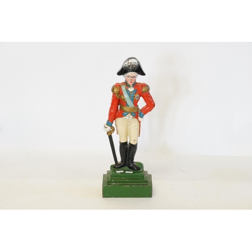 736 - A Cast Iron Door Stop designed as Nelson with painted colours. Measuring: 40cms high.