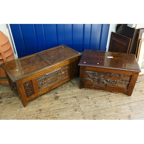 456 - Two 1920s Oak Coffers with later panels carved with scenes.