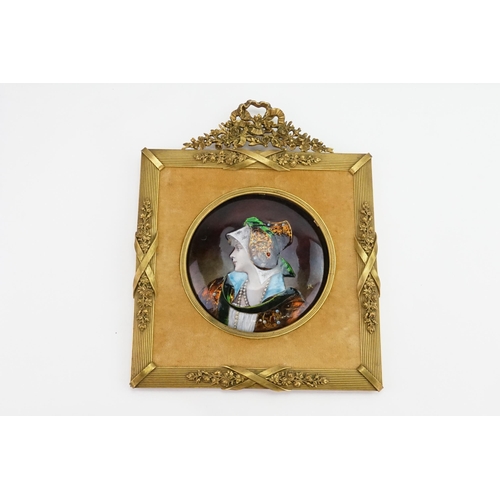 588 - A French Limoges enamelled Circular Portrait of the Burgermeister Daughter, depicting a young with a... 