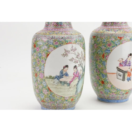 513 - A Pair of Chinese Jin Qua decorated Traditional Bolster Vases decorated with scenes of children & ev... 