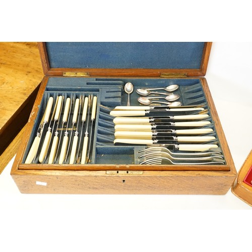 55 - A quantity of Hanoverian patterned Silver Plated Cutlery in two Canteens.