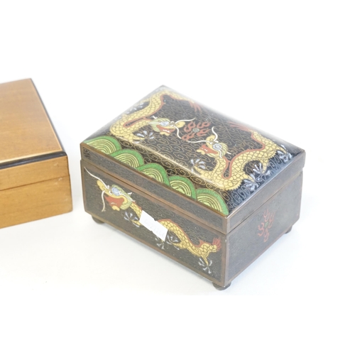 512 - A Cloisonne enamelled Cigarette Box decorated with Dragons along with a Cigar Box.