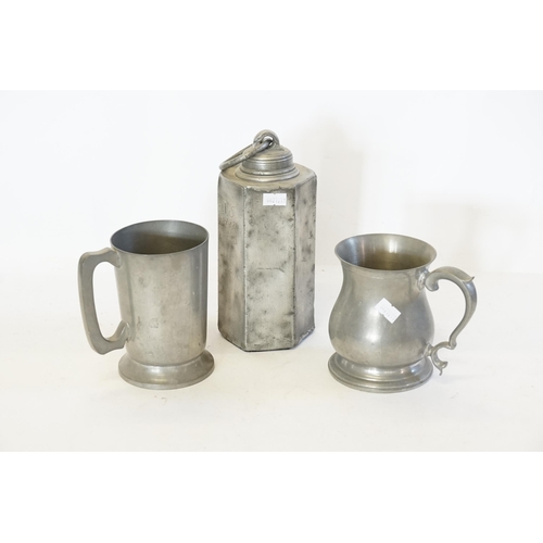 742 - An Antique Swiss Pewter Wine Flask with a Ring Handle & Dated 1821 along with two Pewter Mugs.